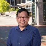 photo of Richmond Wong, smiling, on the UC Berkeley campus near Sather Gate