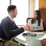 Photo of a man and a woman in a business meeting