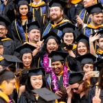 students in graduation regalia at commencement