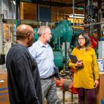 Leslie and technical team inside one of the large mechanical rooms that power the Wright Museum.